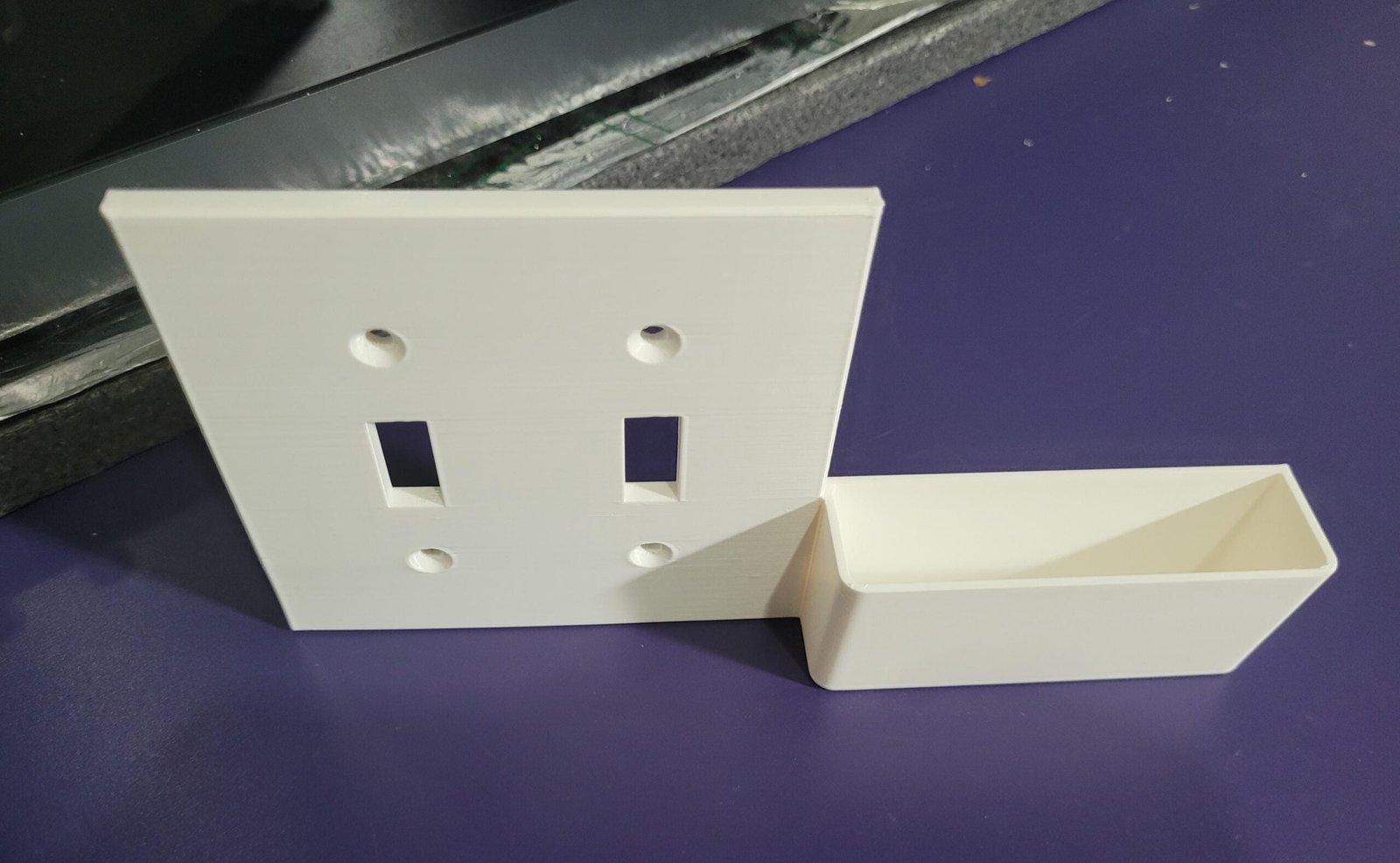 Right-hand printed part of the double switch plate phone holder