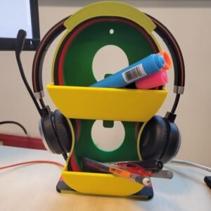 Minimalist 3D printed headphone holder with storage shelves on a desk