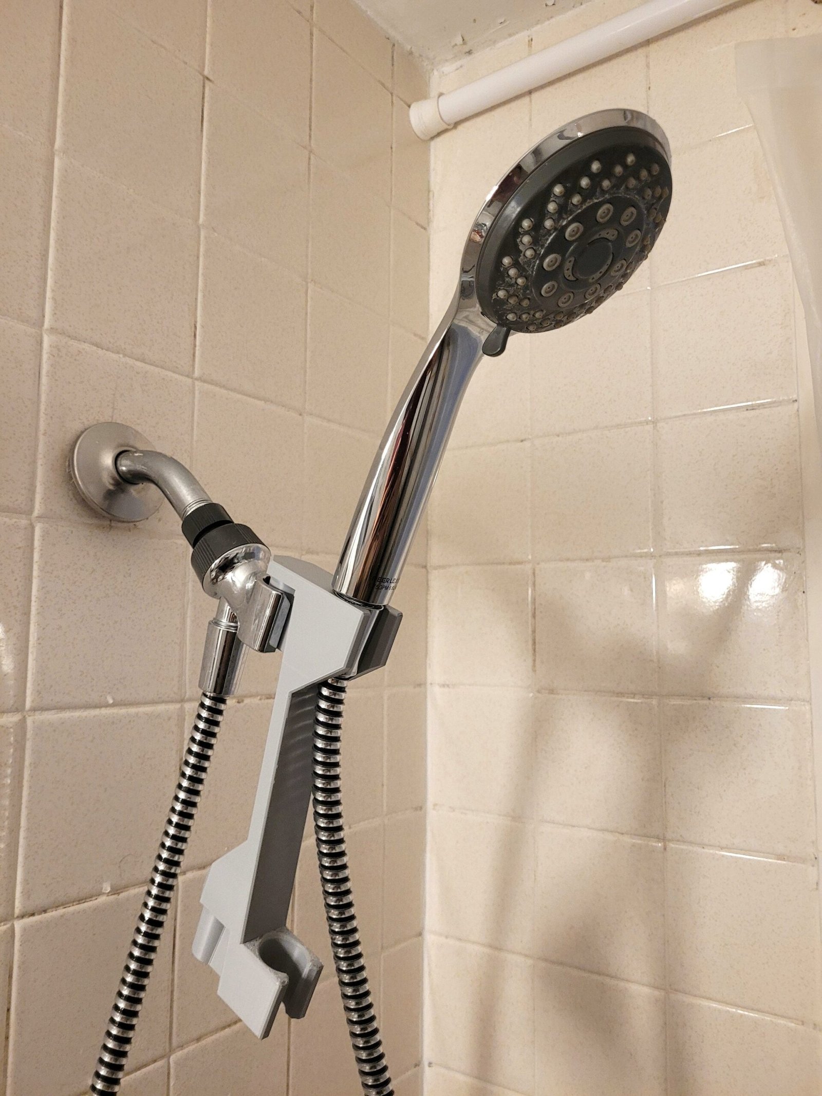 Shower head height adjuster shown in available colour options