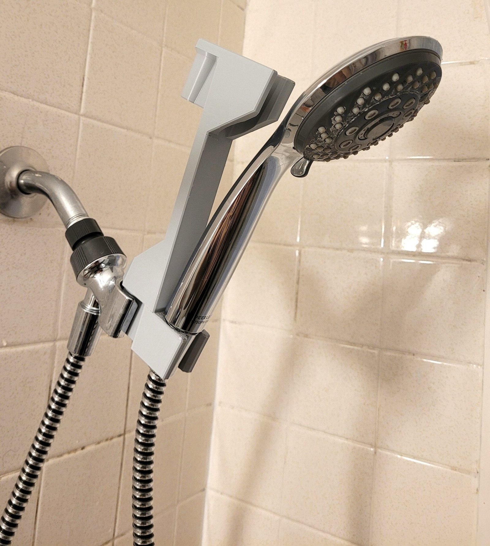 Shower head adjuster set to the upper position for lowering shower height