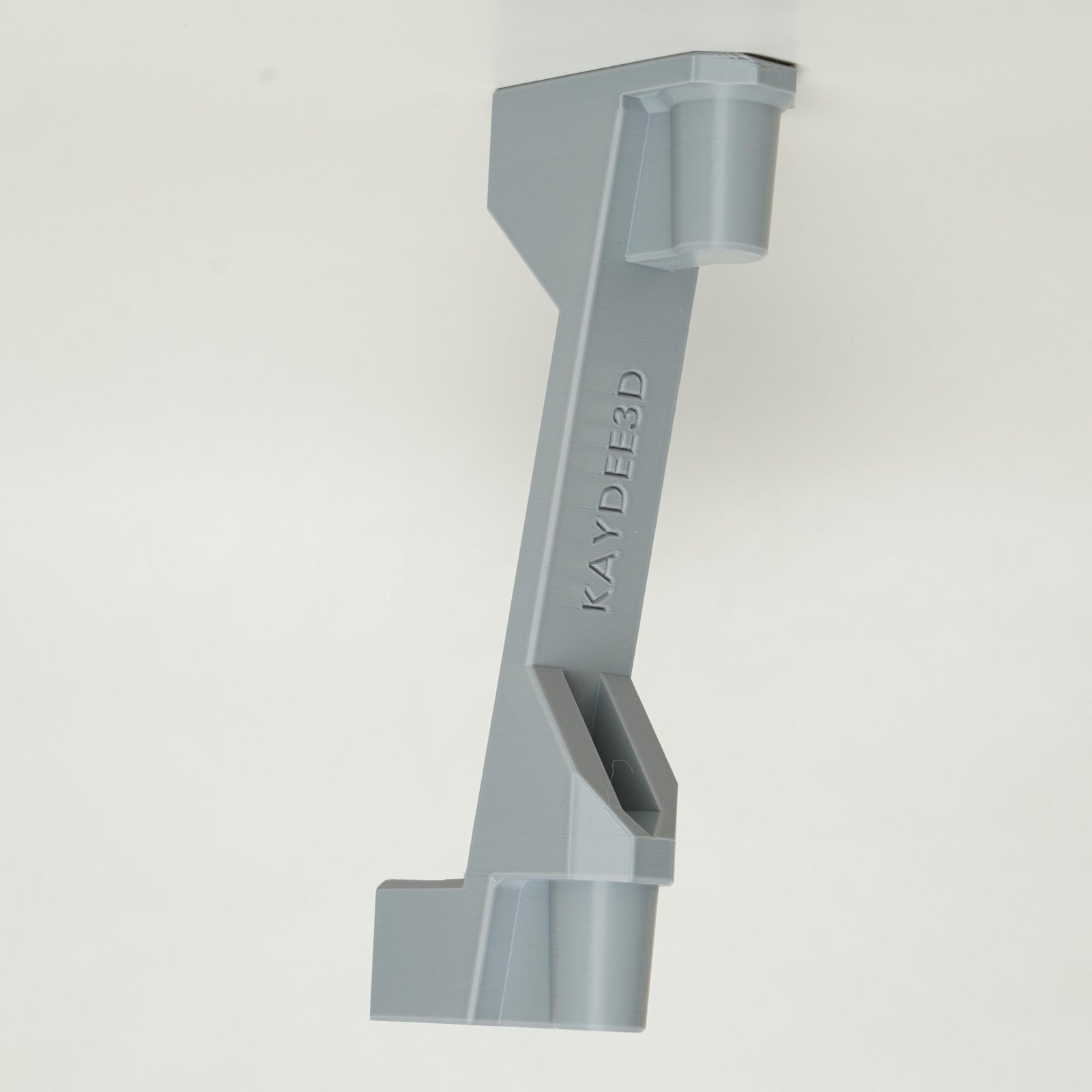 White shower head height adjuster, 3D printed in Canada