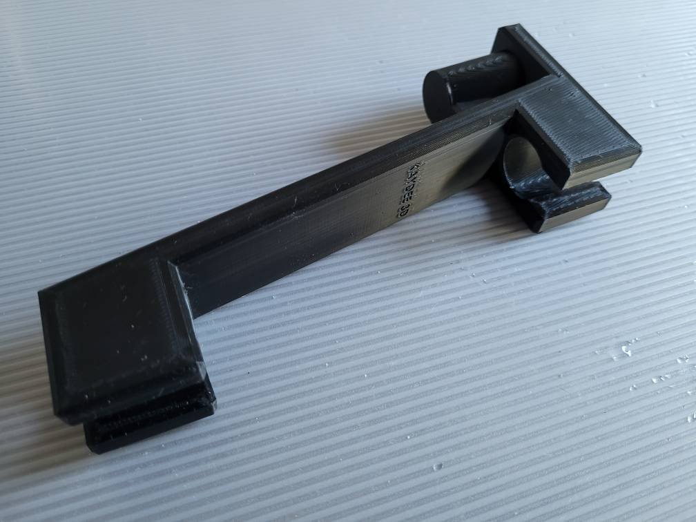 Printed shower head extension installed on a handheld shower