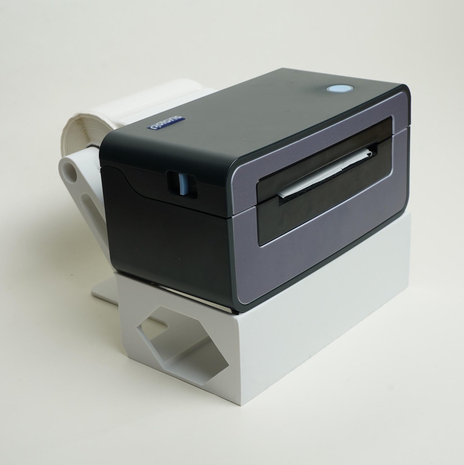 Fanfold labels stored in the thermal label printer stand