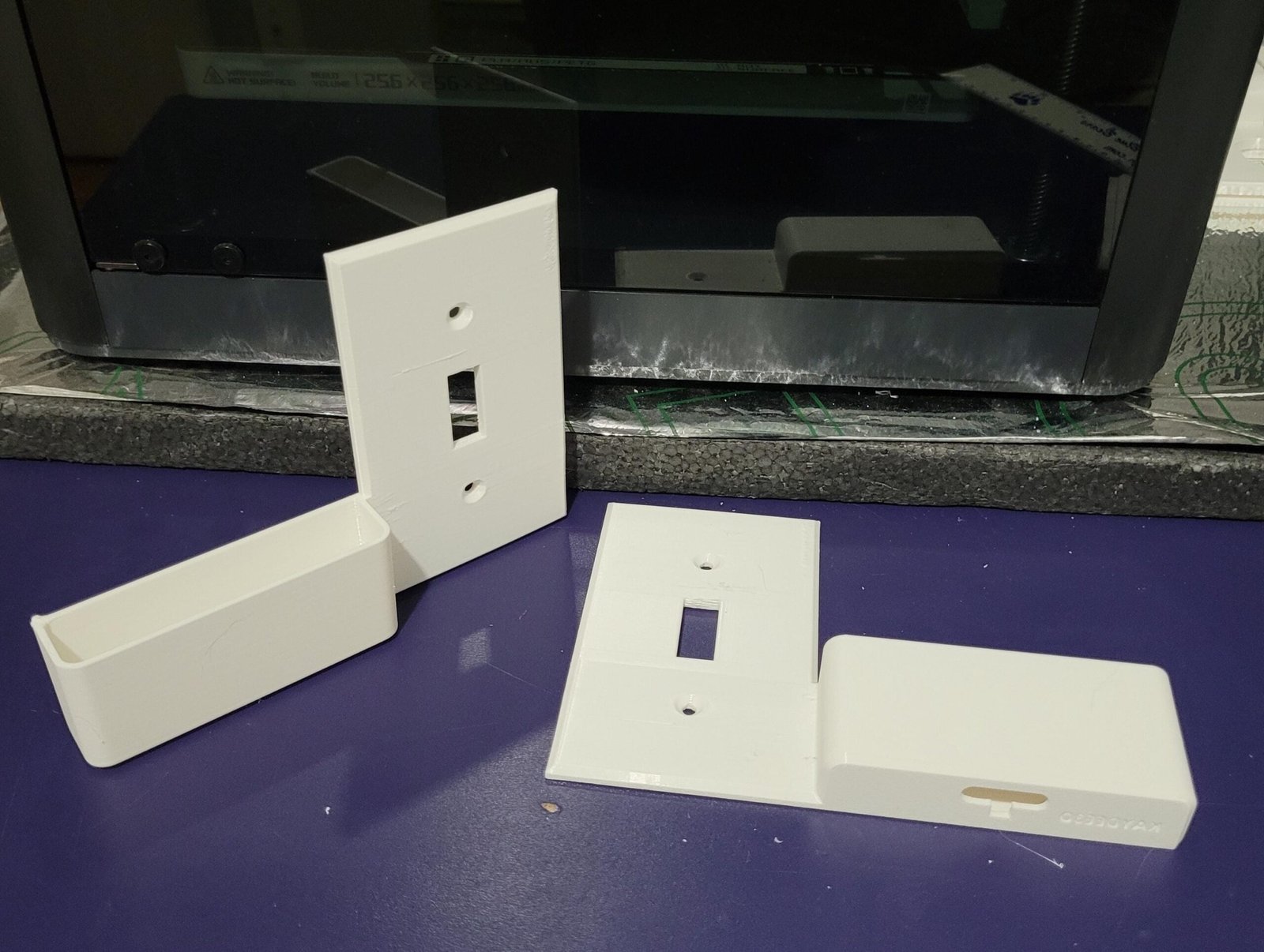 3D printed wall switch plate phone holder part