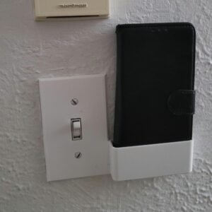 3D render of the wall switch plate phone holder design